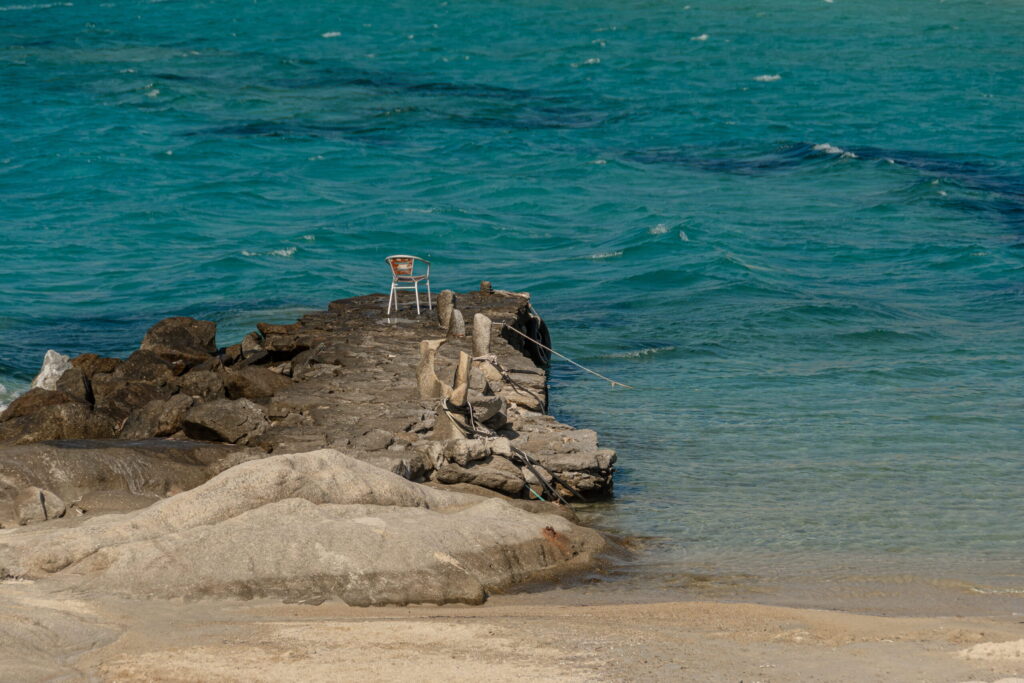 Rocky coast and clear water at Mikri Vigla, Naxos